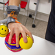 The Third Thumb being used to hold multiple balls.